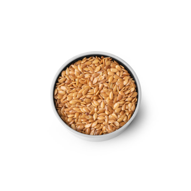 金色亚麻种子在白色碗，俯视图，孤立在白色背景图片下载