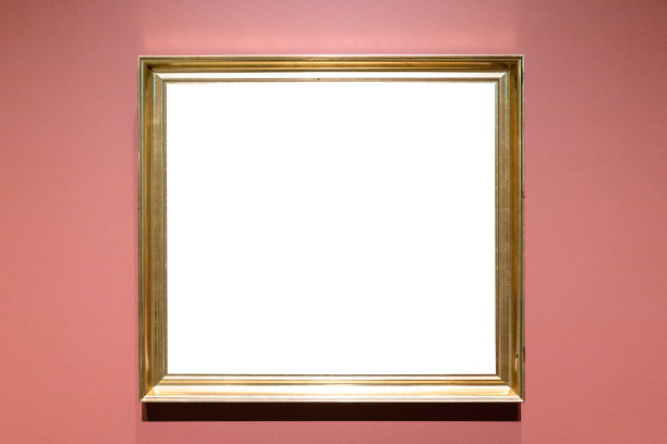 经典的金色相框挂在粉红色的墙上图片下载