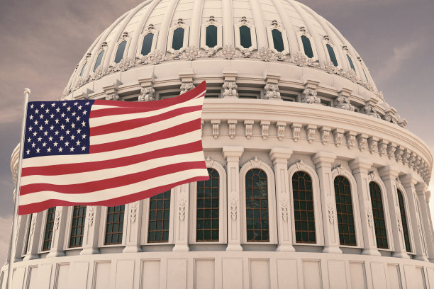 美丽的美国国旗在强风中飘扬，后面是国会大厦的圆顶3D渲染。图片下载