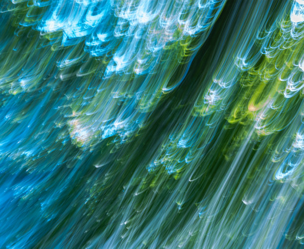 旋涡从光束。抽象的蓝绿色的背景。这张照片是用长曝光移动相机拍的。图片下载