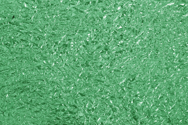 光泽的绿色箔纹理背景，皱巴巴的包装纸图案。图片下载