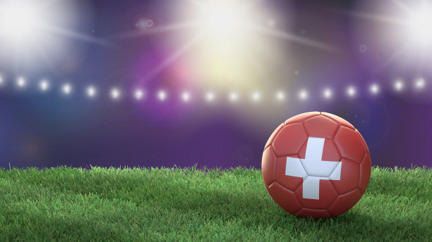 在一个明亮模糊的体育场背景上的国旗颜色的足球。瑞士图片下载