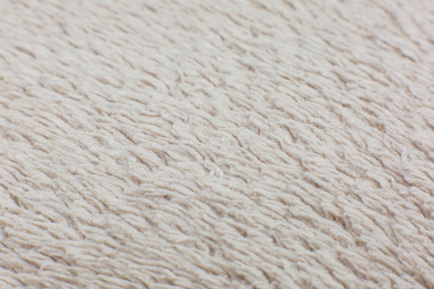 米色棉布毛巾或地毯蓬松的纹理背景。特写，微距照片。软焦点的形象。图片下载
