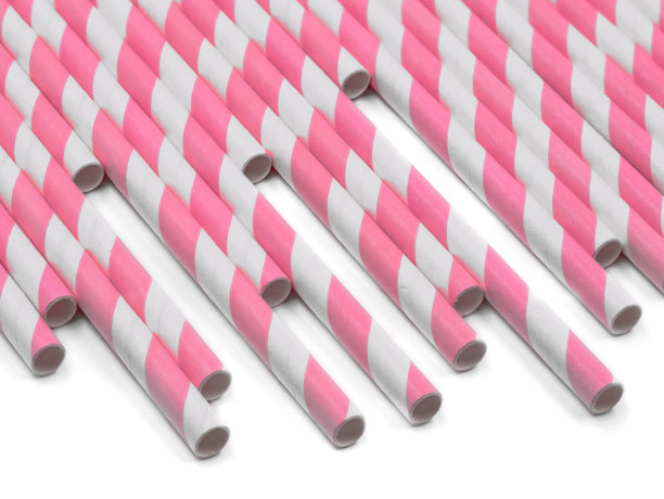 粉红色条纹纸饮用吸管孤立在白色的背景图片下载