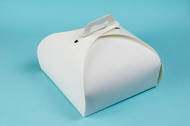 外卖食物。白色的纸蛋糕或午餐盒在浅蓝色的背景。图片下载