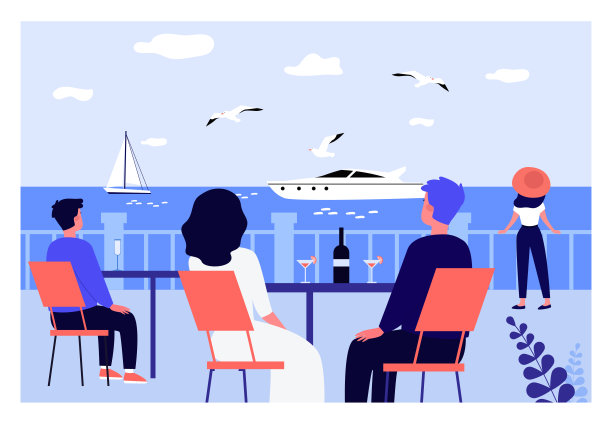 度假者坐在餐厅的桌子前，看着风帆图片下载