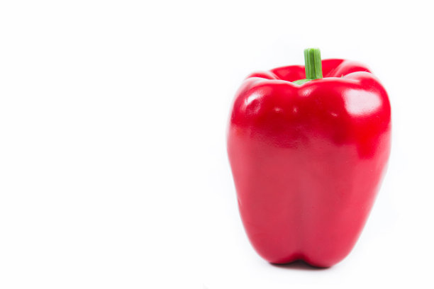 塑料假玩具红色柿子椒在白色的背景。图片下载