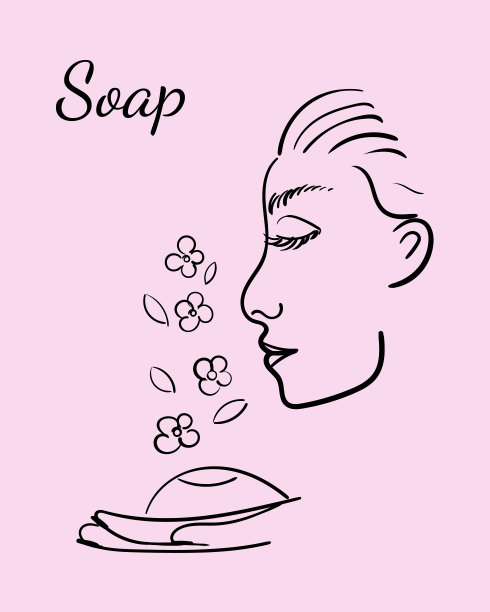 一个女孩的脸在粉红色的背景上嗅着肥皂，花香图片下载