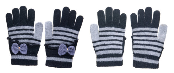 针织手套。手套孤立在白色背景上。手套俯视图。黑色和灰色带蝴蝶结的手套。图片下载