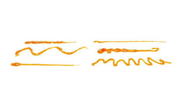 橙色杏子酱溅在白色的背景上。前视图。图片下载