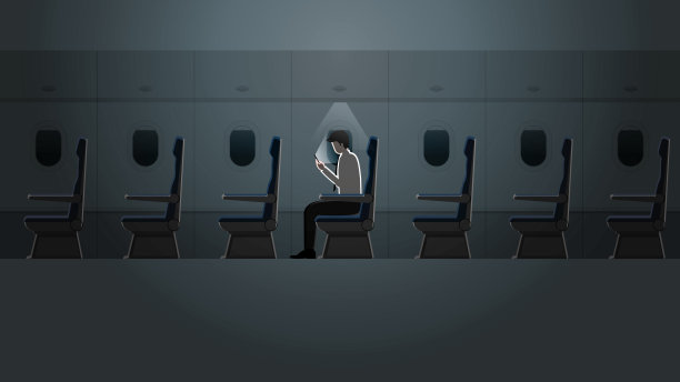 一名工薪族在漆黑的小灯光下独自在机舱里用智能手机工作。一种辛苦加班、加班的出差生活方式。飞机内部有一个空座位。图片下载