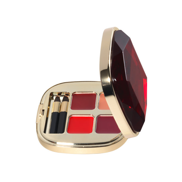 打开化妆品套装与唇彩和涂抹器在金色红色的情况下隔离在白色图片下载