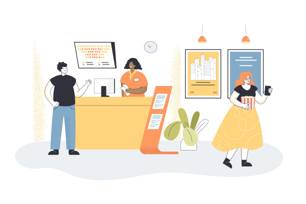 一个男人在电影院的售票处买票图片下载