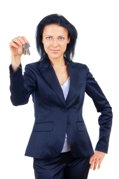 房地产经纪人拿着房子钥匙的背景图片下载