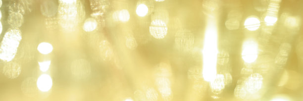 散景圈与金色闪光背景。黄色闪光的背景。黄金图片下载