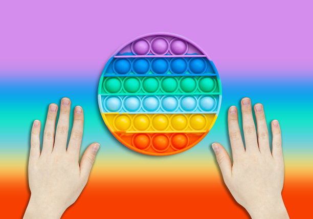 硅胶玩具抗压力壶。新趋势。彩色的抗压力感官玩具烦躁推弹它。平躺与copyspace。图片下载