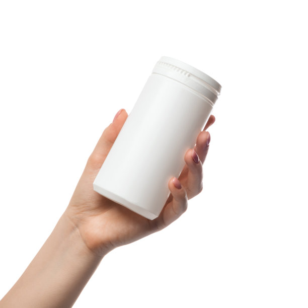 一个白色的塑料罐子，一个女人手里拿着的容器。有一个广告空间或标志。商业产品模板。图片下载