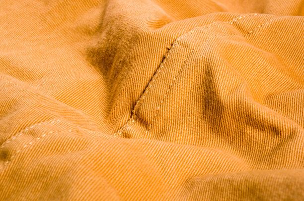 衣服项目石洗棉织物纹理接缝，扣，钮扣和铆钉，宏观图片下载