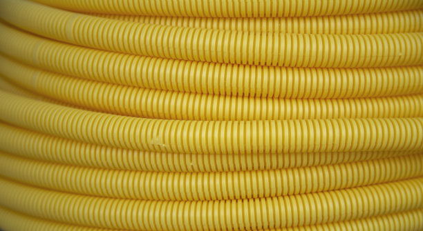 黄色塑料PVC伸缩管纹理图片下载