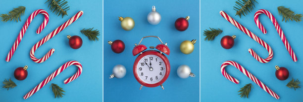 圣诞节的拼贴画。红色闹钟，焦糖棒和云杉树枝在蓝色的背景。前视图。图片下载