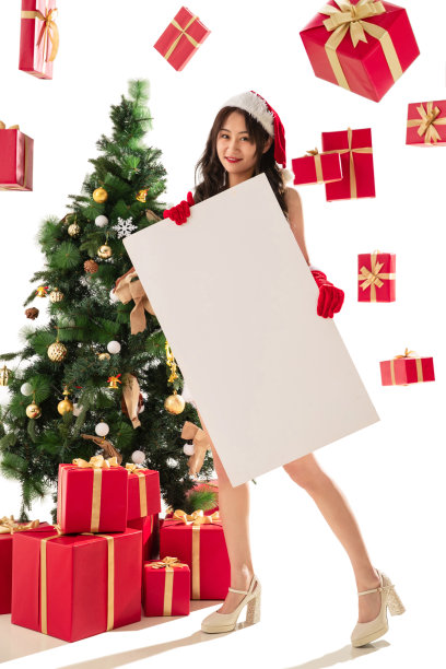 过圣诞节的年轻女人拿着白板图片下载