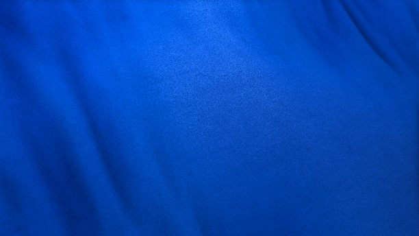 单色蓝色旗布背景在全帧与选择性焦点图片下载