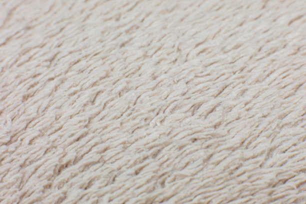 米色棉布毛巾或地毯蓬松的纹理背景。特写，微距照片。软焦点的形象。图片下载
