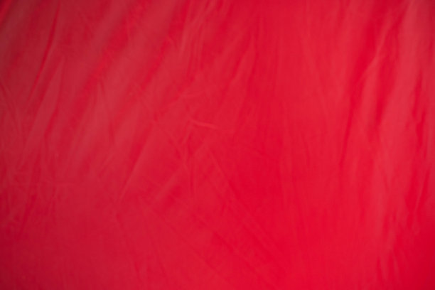 红色皱巴巴的旧帐布页纸纹理粗糙的背景。折痕垃圾羊皮纸图案复古设计图片下载