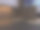现代空室内与棕色墙壁，地板上的棕色瓷砖，射灯和一个大的地板到天花板的窗户图片下载