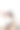 快乐的女人穿着休闲服装拿着空白的气球与copyspace，而坐在地板上双腿交叉孤立的灰色背景图片下载