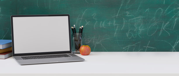 在白色桌子上以绿色黑板为背景的模拟笔记本电脑图片下载