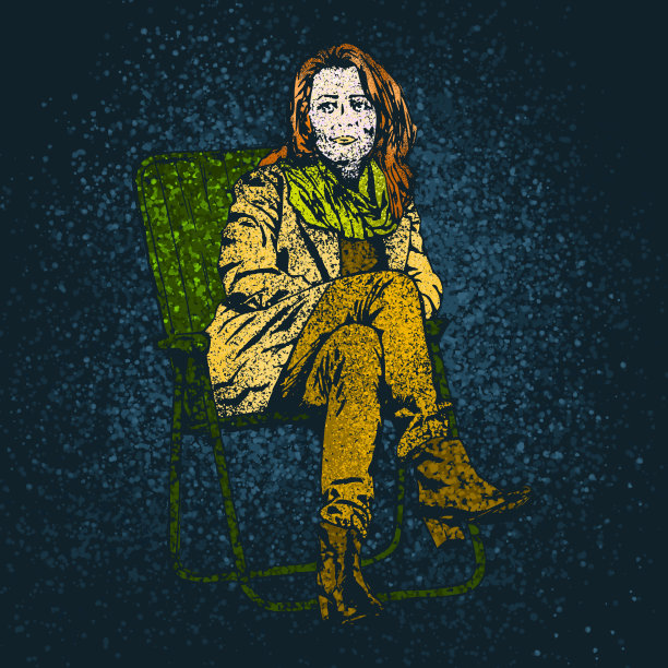 椅子上画着微粒的年轻女子图片下载