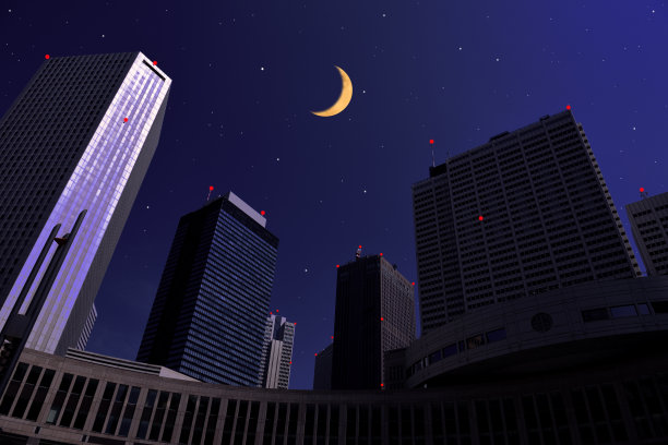 新月从摩天大楼上冉冉升起，上面布满了星星图片下载