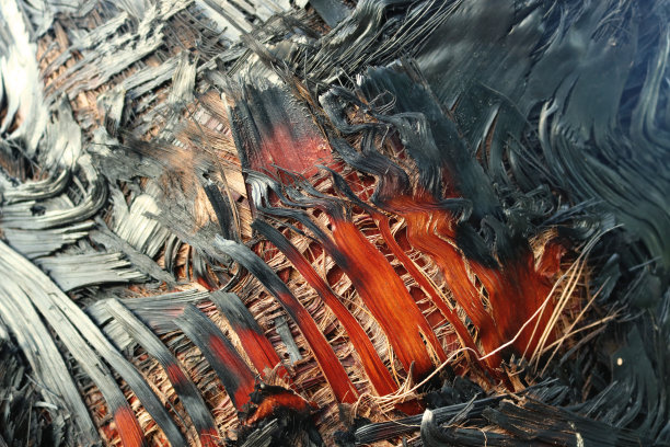 自然黑色和橙色点缀的纹理，烧焦的棕榈树树干具有火纵横交错的效果——明亮抽象的背景为壁纸图片下载