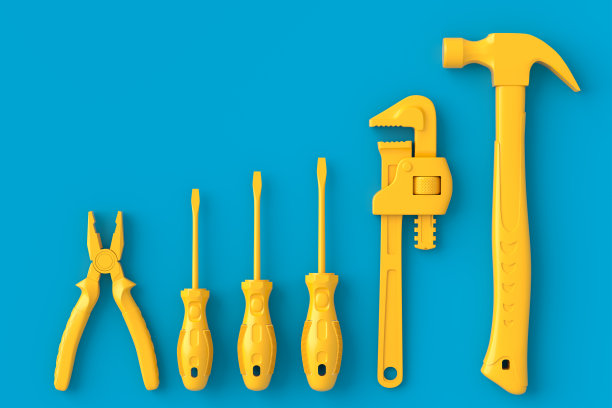 在蓝色和黄色上修理的单色建筑工具的俯视图图片下载