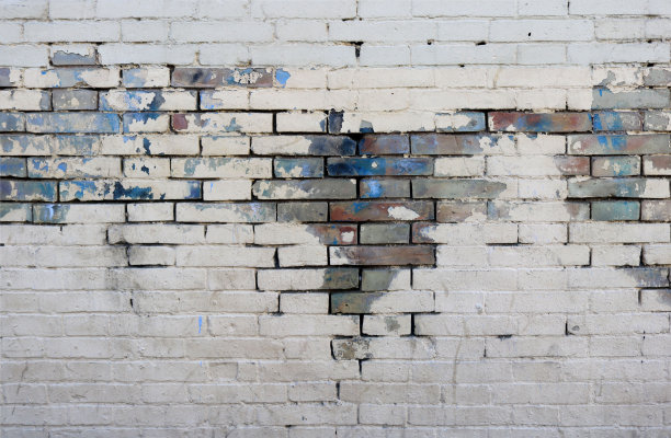 白墙背景与彩色砖与世界地图形状:红色，蓝色，绿色和灰色纹理背景壁纸图片下载