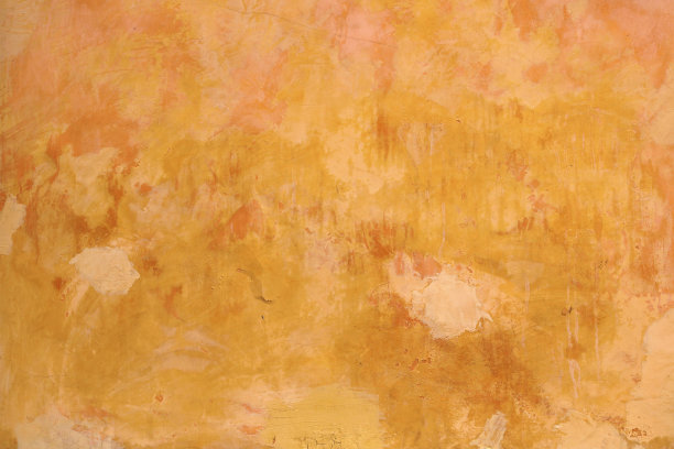 色彩丰富的墙壁，用黄色和橙色色调绘制，表面粗糙、不规则和肮脏的纹理-墙纸背景图片下载