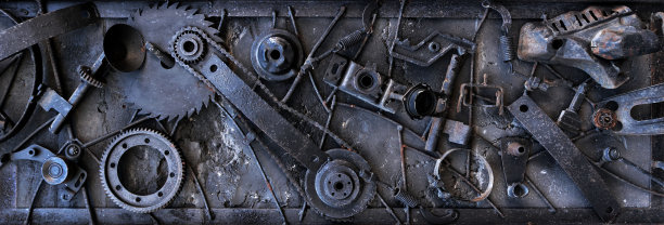 深色蒸汽朋克背景与生锈的工业金属组件组成的风化的水平板图片下载
