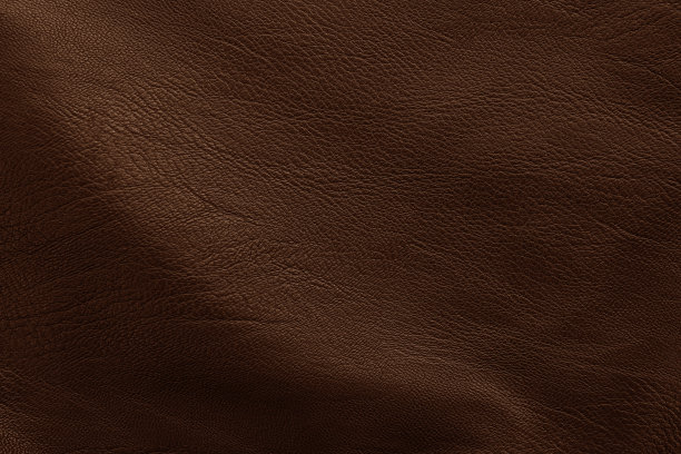 深棕色皮革纹理背景与无缝模式。图片下载