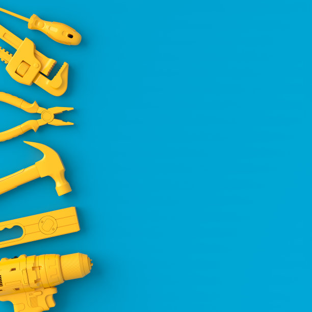 在蓝色和黄色上修理的单色建筑工具的俯视图图片下载