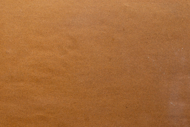 砂纸纹理背景，使砂纸上的沙粒图案看起来很漂亮。它适合作为文本的背景，因为设计师可以在砂纸上使用复制空间。图片下载