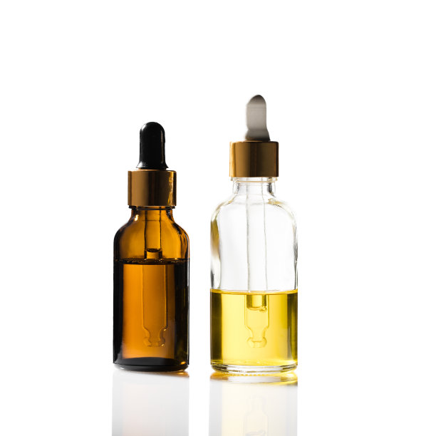 两个带饮料器的化妆品玻璃瓶。图片下载