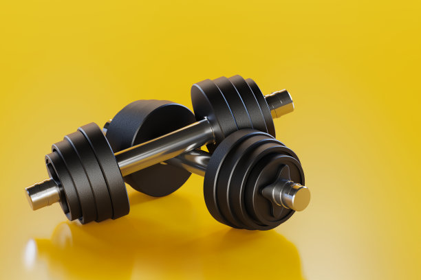 黄色背景下的金属哑铃。重量运动在体育馆的黄色背景。3 d渲染。图片下载