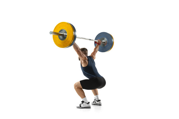 一名男子的全身肖像在运动服锻炼与重量孤立在白色背景图片下载