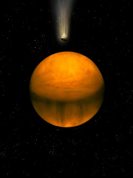 外太空中黄色调的行星和一颗彗星图片下载