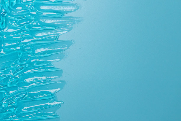 透明蓝色水凝胶表面纹理清澈。皮肤护理化妆品涂抹背景图片下载