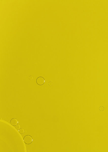 蓝色水中混合黄色食用色素的抽象气泡微距摄影图片下载