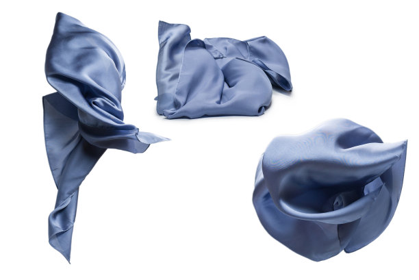 飘逸的蓝色丝巾孤立在白色的背景上。图片下载