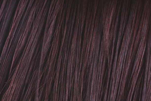 质感女人的湿发。人类头发的特写。美丽的长发作为背景图片下载