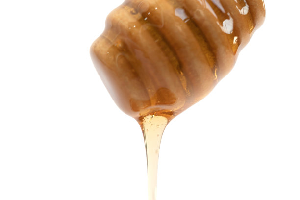 蜂蜜与木勺棒孤立在白色背景。甜的食物。蜜蜂和蜂蜡。花蜜。图片下载